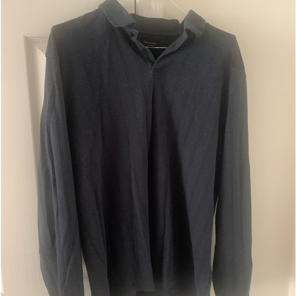 Blueish gray in color. Colored shirt. Long sleeve.